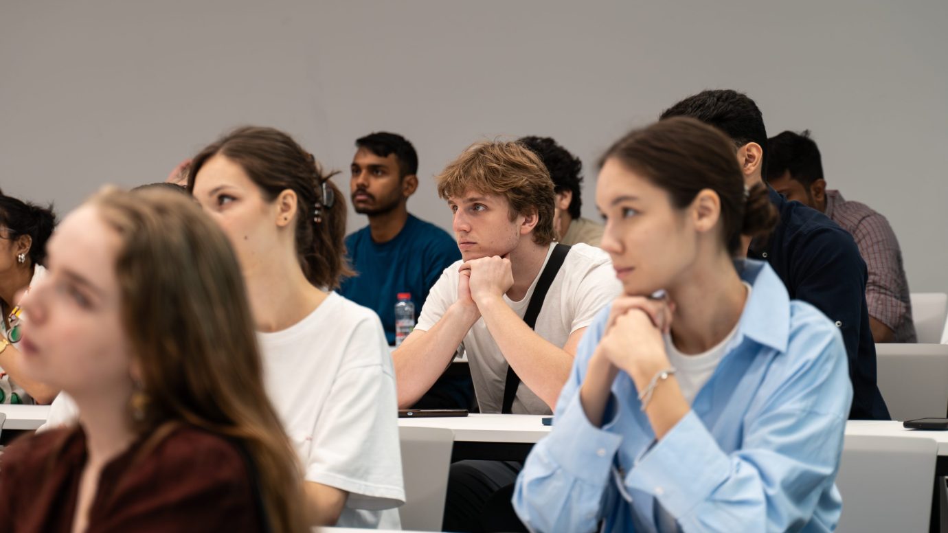 a group of people sitting in a room